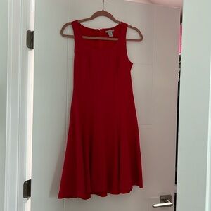 Cute red dress with slight flare in the skirt.